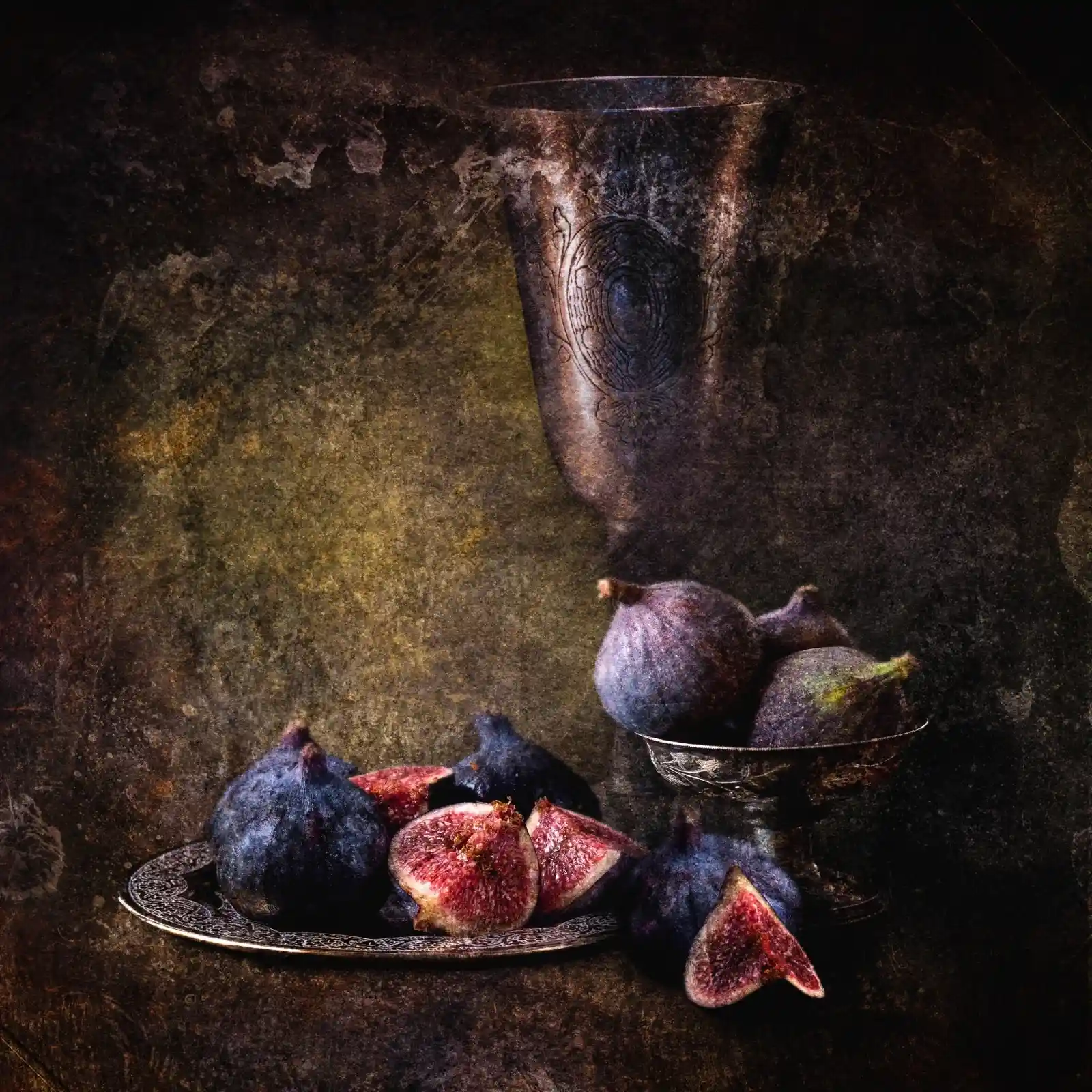 A dark, moody still life: a silver goblet looms over a collection of ripe figs, some whole, others split open to reveal their ruby hearts. The fruit sits upon an ornate silver plate, their rich hues of purples and reds set against a backdrop of deep shadows. The scene is ripe with decadence and a hint of danger, as if this feast belongs to a story where every bite carries a price.