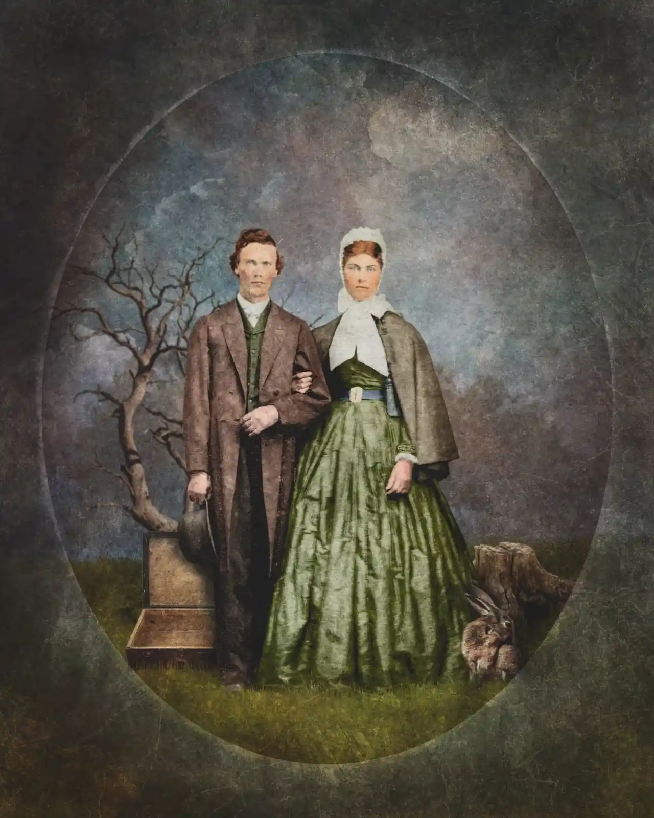 An eerie couple stands arm in arm against a painted oval frame. The man, in his well-worn brown coat, holds a hat by his side. The woman, tall and stern in her green dress, has eyes that seem to pierce through time. A small rabbit hides at the edge, half in shadow, half in moonlight, as if tethered to them by something unseen and unknowable.